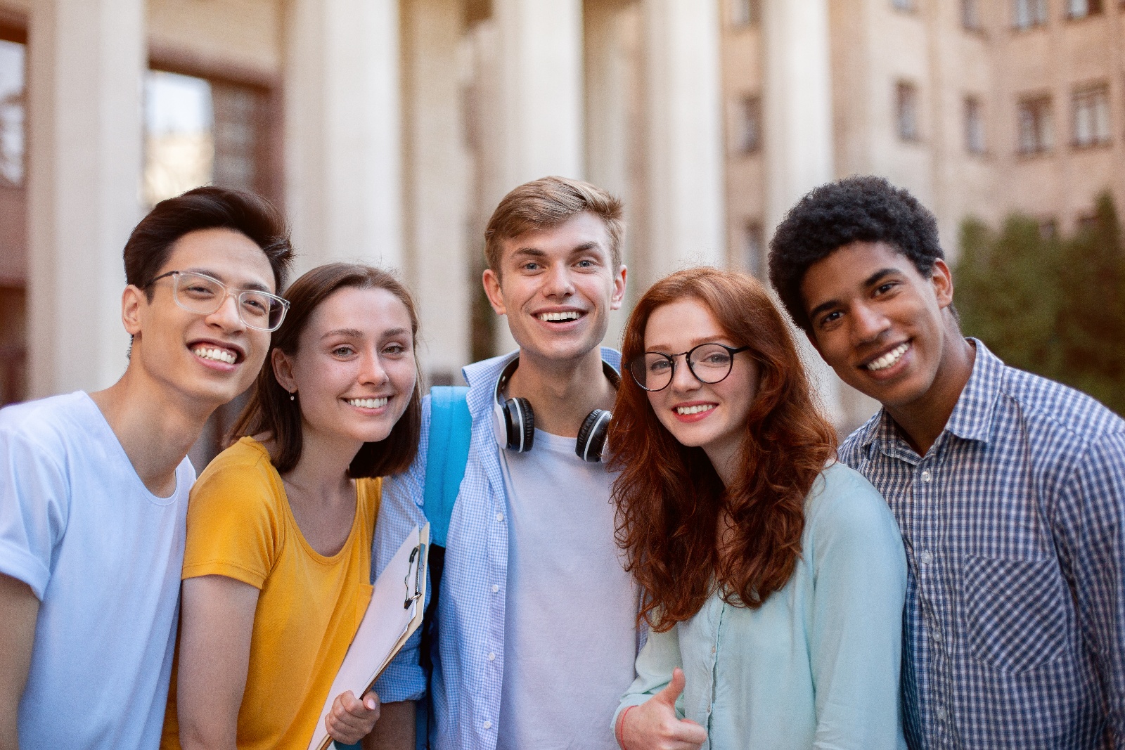 joyful-multiethnic-students-posing-smiling-to-came-2023-11-27-04-53-40-utc-1